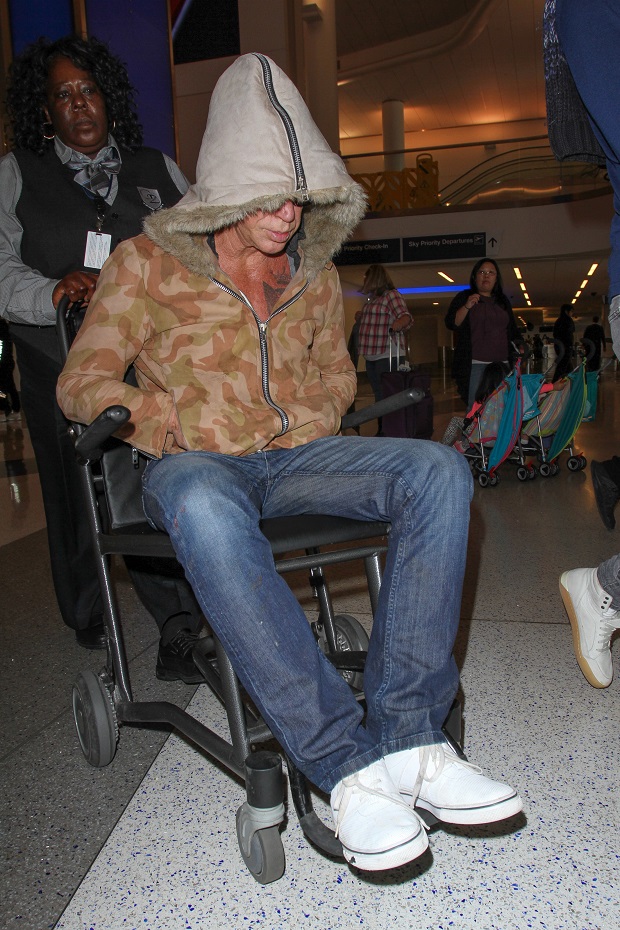 Los Angeles, CA - Mickey Rourke rolls into Los Angeles in time for Thanksgiving at LAX. The actor wore his hoody over his famous face as he was pushed in a wheelchair after a flight from New Orleans to his ride. AKM-GSI November 25, 2015 To License These Photos, Please Contact : Steve Ginsburg (310) 505-8447 (323) 423-9397 steve@akmgsi.com sales@akmgsi.com or Maria Buda (917) 242-1505 mbuda@akmgsi.com ginsburgspalyinc@gmail.com All Over Press