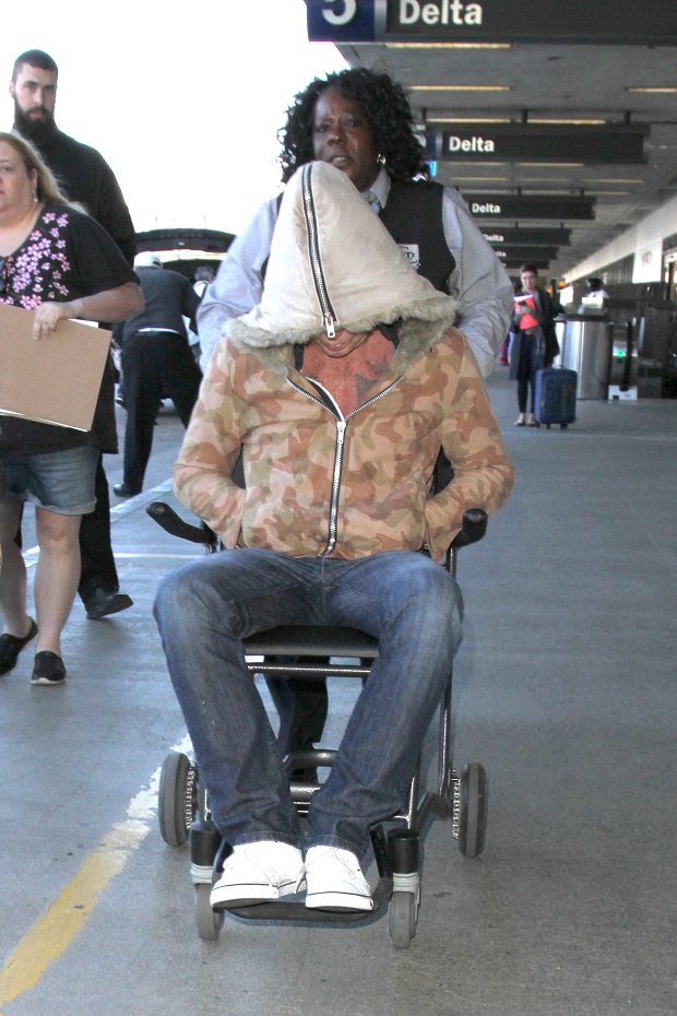 Mickey Rourke needs the assistance of a wheelchair as he arrives in Los Angeles the day before Thanksgiving. The legendary actor was seen at LAX. Pictured: Mickey Rourke Ref: SPL1185099 251115 Picture by: Sharky / Splash News Splash News and Pictures Los Angeles: 310-821-2666 New York: 212-619-2666 London: 870-934-2666 photodesk@splashnews.com 